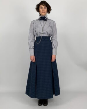 Michele Clapton Instagram - Polly’s costumes. I loved designing these! For the most part her costumes are relatively understated but the cut was key and I was lucky enough to have the genius Mel Carter as her cutter.  Gemma Arterton is wonderful to collaborate with and has such great posture and awareness of character. In the first fitting we discussed Polly and both agreed that we loved the idea of laced knee high boots being her signature item. They worked perfectly for the ‘action outfit’ but also gave the character a certain hidden strength even when dressed as staff. I wanted them to be in supple leather and to follow the line of the leg closely. I also wanted an elegant narrow cut to the toe, I wanted them to subtly elevate her station…The first look here with leather jacket and jodhpurs we actually see very late in the film, it’s a sort of revelation! I wanted it to be created out of period correct items but maybe worn in a quite racy way for women of the time, yet to be effortlessly stylish and practical. We had to make many copies of this outfit because of the cheese explosion scene..The next look here is Polly’s staff look. I didn’t want it too traditional yet it’s style would influence all of the other staff’s costumes so I had to be a little careful. I chose the colour palate of blues and pale grey which softened the usual black and white, and I dispensed with any frills, it seemed to be in keeping with my sense of Oxford and his late wife’s character.  In photo five we put together looks on stands to experiment as to how we might dress other members of staff within the same palate. The funeral suit ( fitting stage here) is very utilitarian with its bound edged patched pockets but beautifully cut. I adore the blue wool fabric  and brown binding together here. Finally I designed the green overall to delineate Polly’s different roles, so that when Conrad is finally shown the secret room we find Polly looking unlike her usual self..I thought this visually underlined his up till then exclusion.. assistant designer @sophie__oneill boots  @jitterbug.boy