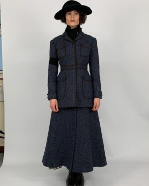 Michele Clapton Instagram - Polly’s costumes. I loved designing these! For the most part her costumes are relatively understated but the cut was key and I was lucky enough to have the genius Mel Carter as her cutter.  Gemma Arterton is wonderful to collaborate with and has such great posture and awareness of character. In the first fitting we discussed Polly and both agreed that we loved the idea of laced knee high boots being her signature item. They worked perfectly for the ‘action outfit’ but also gave the character a certain hidden strength even when dressed as staff. I wanted them to be in supple leather and to follow the line of the leg closely. I also wanted an elegant narrow cut to the toe, I wanted them to subtly elevate her station…The first look here with leather jacket and jodhpurs we actually see very late in the film, it’s a sort of revelation! I wanted it to be created out of period correct items but maybe worn in a quite racy way for women of the time, yet to be effortlessly stylish and practical. We had to make many copies of this outfit because of the cheese explosion scene..The next look here is Polly’s staff look. I didn’t want it too traditional yet it’s style would influence all of the other staff’s costumes so I had to be a little careful. I chose the colour palate of blues and pale grey which softened the usual black and white, and I dispensed with any frills, it seemed to be in keeping with my sense of Oxford and his late wife’s character.  In photo five we put together looks on stands to experiment as to how we might dress other members of staff within the same palate. The funeral suit ( fitting stage here) is very utilitarian with its bound edged patched pockets but beautifully cut. I adore the blue wool fabric  and brown binding together here. Finally I designed the green overall to delineate Polly’s different roles, so that when Conrad is finally shown the secret room we find Polly looking unlike her usual self..I thought this visually underlined his up till then exclusion.. assistant designer @sophie__oneill boots  @jitterbug.boy