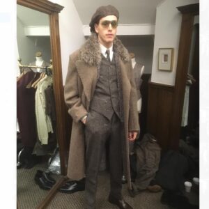 Michele Clapton Instagram - Conrad suits.  Ok you might be bored of me showing these costumes by now.. but if you are then look away! I just love to go back and remember/enjoy our work, as it’s sometimes so hard to do so in the thick of filming. These are fitting photos so the costumes are unfinished.
We loved our fittings with Harris Dickinson who played Conrad. It’s often difficult for younger actors used to wearing sports wear to feel comfortable in period cut clothes, especially the stiff high collars, so we spend time in fittings with the choreography of a costume, how it makes you walk and stand.. it’s a real aid. Harris bought so much to this role and ended up loving this style…he really made the costumes his own and we loved that his body shape was so good for the period cut.. the modern muscular shoulders and arms are more difficult to accommodate in these narrow suits.. Matthew Vaughn the director is obsessed by the cut and fall of mens suits so he really kept us on our toes. We made some suits in our work room cut by the wonderful Tim Perkins and others were made by the incredible Campbell and his team at Huntsman. The final suit here was one of my favourites and much lighter weight, it was the most unusual, quite American in cut, I liked it for the scene in Sarajevo. It was really difficult fabric to work with and we had to make multiples for the stunt scene.. Campbell was not impressed! But it turned out great! Shoes by George Cleverley complete the looks and glasses made to our design by Cuttler and Gross. Klaire Jamin on buying duty again killed it..along with assistant designers Alex Fordham,
Sophie O’Neill, Emma O’Loughlin, illustrator Simon Thorpe 
@huntsmansavilerow @timjohnperkins @sim0ndo @cutlerandgross @georgecleverley