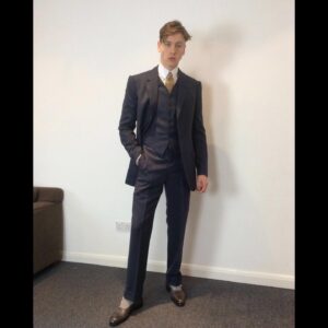 Michele Clapton Instagram - Conrad suits.  Ok you might be bored of me showing these costumes by now.. but if you are then look away! I just love to go back and remember/enjoy our work, as it’s sometimes so hard to do so in the thick of filming. These are fitting photos so the costumes are unfinished.
We loved our fittings with Harris Dickinson who played Conrad. It’s often difficult for younger actors used to wearing sports wear to feel comfortable in period cut clothes, especially the stiff high collars, so we spend time in fittings with the choreography of a costume, how it makes you walk and stand.. it’s a real aid. Harris bought so much to this role and ended up loving this style…he really made the costumes his own and we loved that his body shape was so good for the period cut.. the modern muscular shoulders and arms are more difficult to accommodate in these narrow suits.. Matthew Vaughn the director is obsessed by the cut and fall of mens suits so he really kept us on our toes. We made some suits in our work room cut by the wonderful Tim Perkins and others were made by the incredible Campbell and his team at Huntsman. The final suit here was one of my favourites and much lighter weight, it was the most unusual, quite American in cut, I liked it for the scene in Sarajevo. It was really difficult fabric to work with and we had to make multiples for the stunt scene.. Campbell was not impressed! But it turned out great! Shoes by George Cleverley complete the looks and glasses made to our design by Cuttler and Gross. Klaire Jamin on buying duty again killed it..along with assistant designers Alex Fordham,
Sophie O’Neill, Emma O’Loughlin, illustrator Simon Thorpe 
@huntsmansavilerow @timjohnperkins @sim0ndo @cutlerandgross @georgecleverley