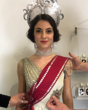 Michele Clapton Instagram - Finally on this theme some fitting photos from the Russian ball. We made approximately 50 dresses in the palate that we had decided for this scene. We found around 15 dresses in costumes houses that were also in the correct colours, that helped a bit. Along with the women’s costumes that we made in house the wonderful Hero in Poland made for us many uniforms that we also had to fit. We always need to create extra pieces in advance to fit with as scenes are not cast until near the time of filming and we needed to start the making process much earlier…so maybe 15 dresses were not eventually used…We also made all the headpieces and made and rented the other jewels. We transported all to Turin from London and then fitted the part unfinished costumes (hems etc) to supporting artists and made the necessary alterations and completed. Once fitted we dyed all the shoes and gloves to match the dresses and prepared all the military orders to be worn. It was epic and also so exciting to work with the Makeup and Hair team to see the looks coming together. Thank you to all the British and Italian Costume depts, such great work and attention to detail, you really helped to realise the vision. It takes an army to create these scenes and we are just one department of many…