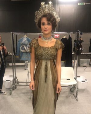 Michele Clapton Instagram - Finally on this theme some fitting photos from the Russian ball. We made approximately 50 dresses in the palate that we had decided for this scene. We found around 15 dresses in costumes houses that were also in the correct colours, that helped a bit. Along with the women’s costumes that we made in house the wonderful Hero in Poland made for us many uniforms that we also had to fit. We always need to create extra pieces in advance to fit with as scenes are not cast until near the time of filming and we needed to start the making process much earlier…so maybe 15 dresses were not eventually used…We also made all the headpieces and made and rented the other jewels. We transported all to Turin from London and then fitted the part unfinished costumes (hems etc) to supporting artists and made the necessary alterations and completed. Once fitted we dyed all the shoes and gloves to match the dresses and prepared all the military orders to be worn. It was epic and also so exciting to work with the Makeup and Hair team to see the looks coming together. Thank you to all the British and Italian Costume depts, such great work and attention to detail, you really helped to realise the vision. It takes an army to create these scenes and we are just one department of many…