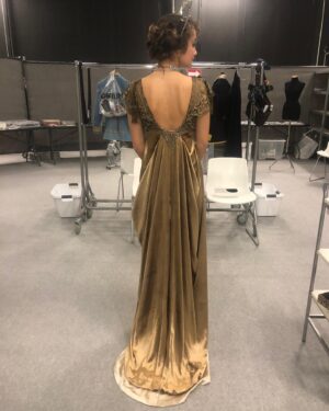Michele Clapton Instagram - Finally on this theme some fitting photos from the Russian ball. We made approximately 50 dresses in the palate that we had decided for this scene. We found around 15 dresses in costumes houses that were also in the correct colours, that helped a bit. Along with the women’s costumes that we made in house the wonderful Hero in Poland made for us many uniforms that we also had to fit. We always need to create extra pieces in advance to fit with as scenes are not cast until near the time of filming and we needed to start the making process much earlier…so maybe 15 dresses were not eventually used…We also made all the headpieces and made and rented the other jewels. We transported all to Turin from London and then fitted the part unfinished costumes (hems etc) to supporting artists and made the necessary alterations and completed. Once fitted we dyed all the shoes and gloves to match the dresses and prepared all the military orders to be worn. It was epic and also so exciting to work with the Makeup and Hair team to see the looks coming together. Thank you to all the British and Italian Costume depts, such great work and attention to detail, you really helped to realise the vision. It takes an army to create these scenes and we are just one department of many…