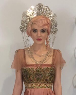 Michele Clapton Instagram - Finally on this theme some fitting photos from the Russian ball. We made approximately 50 dresses in the palate that we had decided for this scene. We found around 15 dresses in costumes houses that were also in the correct colours, that helped a bit. Along with the women’s costumes that we made in house the wonderful Hero in Poland made for us many uniforms that we also had to fit. We always need to create extra pieces in advance to fit with as scenes are not cast until near the time of filming and we needed to start the making process much earlier…so maybe 15 dresses were not eventually used…We also made all the headpieces and made and rented the other jewels. We transported all to Turin from London and then fitted the part unfinished costumes (hems etc) to supporting artists and made the necessary alterations and completed. Once fitted we dyed all the shoes and gloves to match the dresses and prepared all the military orders to be worn. It was epic and also so exciting to work with the Makeup and Hair team to see the looks coming together. Thank you to all the British and Italian Costume depts, such great work and attention to detail, you really helped to realise the vision. It takes an army to create these scenes and we are just one department of many…