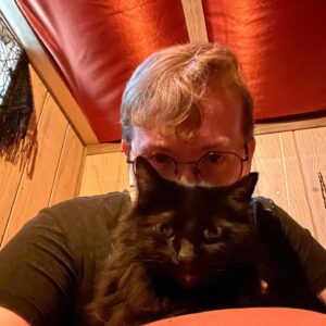 Michelle Belanger Instagram - Bliss & I say hi from my current writing nook. #catsofinstagram #Catstagram #BlackCat #RescueCat #AmWriting #Glasses #FloofyCat #Floof