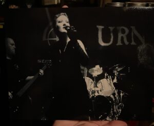 Michelle Belanger Instagram - Once upon a time on stage … performing with URN years ago now. DJ Ian Nothing on bass to the viewer’s left, the late (and sorely missed!) Dominic St. Charles on guitars to the right. #music #metal #vampires #darkmetal #onstage #noir #goth #rip