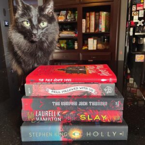 Michelle Belanger Instagram - Went to take a picture of the most recent arrivals for my #bookmas pile & Bliss decided it was the purrfect time to pose with the prose. Here are books by @rkadrey @official_lkhamilton @stephenkingofficialpage @vampirejacktownson  #bookstagram #blackcat #catsofinstagram #happyholidays #amreading