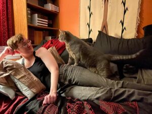 Michelle Belanger Instagram - Ozzy is an enormous cat. 6’1” human for comparison. (That human is me, taken by @elyriarose ) #catsofinstagram #catstagram #BengalCat #RescueCat #BigDamnCat