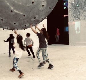 Michelle Clunie Instagram - Such a fun day, a very New York day. We went down to pier 36 to the Balloon Museum and had a ball, literally. They had a ball pit the size of an entire warehouse floor. Towards the end of the exhibit there was this enormous giant ball with charcoal sticking out of it. As the kids played keepie uppie with the ball it would make marks on the surrounding walls, sometimes creating a nice little abstract. Anyway, fun times. I love NY in that you can step outside your front door and end up making friends for life. It’s a great city for a kid. That’s just the magic of Ny. It’s a town for people who love people, who love diversity- all diversity. Anyway, here is Dashiell having a ball last month. 🍎🍎🍎