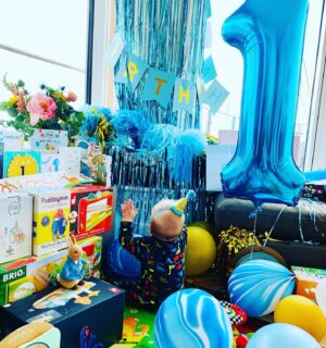 Michelle Dewberry Instagram - And just like that, our little, much loved peanut head turned ‘1’. 👶🏻❤️☺️. He’s a beautiful, fun baby and the most inquisitive/curious little boy I’ve ever met. Nothing (and I mean nothing!) gets past him without a thorough investigation first 🤣
.
.
In my head, he’s not really 1 tho. He was born over 2 months prematurely so saying he’s one almost makes me feel a bit cheated out of his first year. So yes, he’s 1 on paper, but 10months old to us. (Once he gets past his first year from his due date, I guess it matters less but for now, to me, he’s 10 months). Any other preemie parents know what I mean? 
.
.
For his birthday, we kept things simple - I don’t like to spoil my son so we didn’t get him a single gift (poor kid 🤣🤦🏼‍♀️) and we kept things simple again with a gathering of friends at a local pub. It was so lovely to see everyone and bubba did get lots of lovely, kind gifts from friends and family (which I didn’t let him open all on one day but instead spread out over a week! 🤣🤣). I was touched by the effort people made ❤️
.
.
I was gonna do a nice 1st birthday pic Instagram style, but being honest - I couldn’t be bothered 🤣🤦🏼‍♀️ so here we are blowing out the cake candle and with a very untidy, birthday corner. 
.
.
I like to keep my bubba private but I share, as always, to give encouragement and hope to anyone who is currently experiencing PPROM or NICU to try and show you that there is light at the end of the tunnel. Stay strong, you got this xx 
.
.
.
#babyboy #mumandson #1stbirthday #birthdayboy #love #preemie #31weeker #pprom #ppromawareness #nicumama #nicuwarrior #nicu #28weeker