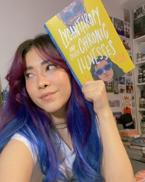 Michelle Grondine Instagram - when you match your reading material 👀💙 

i’m a little behind on my tbr rn but i just started this Teen Wolf meets Emergency Contact vibes story, LYCANTHROPY AND OTHER CHRONIC ILLNESSES by Kristen O’Neal, starring a main character, Priya, a premed student diagnosed with chronic lyme disease, who embarks on a road trip to find her online friend Brigid IRL when Brigid stops virtually showing up to their regular Discord chronic illness support group, only to find an unexpected surprise awaiting for her at her destination. 

in their author note, O’Neal writes: “I wrote it for everyone who felt the loneliness, isolation, and invisibility that comes with being young and being sick.” living with chronic pain myself, that made me even more intrigued to embark on this journey with Priya, Brigid, and their Discord server support group. in this panna cotta, my biggest sources of support have come from the Discord servers I am a part of, so—HEAVY RELATE. hooray for found family!

Q: what are some outlets, hobbies, or things that helped you cope through challenging times?

thanks again to @quirkbooks for sending me this finished copy, along with the following amazing character playlist for Brigid, which I plan to listen to while I read this:

♡︎Brigid’s Playlist♥︎
1. Philosophize In It! Chemicalize With It! — Kishi Bashi
2. Looking Like You Just Woke Up — The Front Bottoms
3. Head Is a Flame (Cool With It) — Portugal. The Man
4. I Wanna Get Better — Bleachers
5. The Ice of Boston — Dismemberment Plan
6. Mouth of the Cave — Typhoon 
7. Complicated Creation — Cloud Cult
8. Semi-Automatic — Twenty One Pilots
9. The Sickness Unto Death — Typhoon
10. Artificial Light — Typhoon
11. If You Want Blood (You’ve Got It) — AC/DC
12. Sleep Forever — Portugal. The Man

for the full playlist, visit: bit.ly/brigidsplaylist 🎶 have a great rest of your wednesday !!! 𓆉