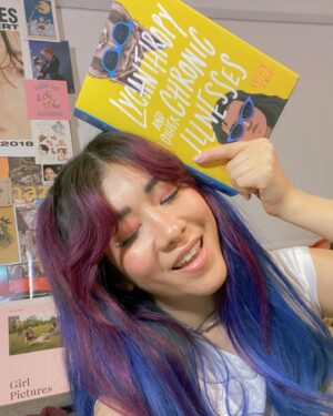 Michelle Grondine Instagram - when you match your reading material 👀💙 

i’m a little behind on my tbr rn but i just started this Teen Wolf meets Emergency Contact vibes story, LYCANTHROPY AND OTHER CHRONIC ILLNESSES by Kristen O’Neal, starring a main character, Priya, a premed student diagnosed with chronic lyme disease, who embarks on a road trip to find her online friend Brigid IRL when Brigid stops virtually showing up to their regular Discord chronic illness support group, only to find an unexpected surprise awaiting for her at her destination. 

in their author note, O’Neal writes: “I wrote it for everyone who felt the loneliness, isolation, and invisibility that comes with being young and being sick.” living with chronic pain myself, that made me even more intrigued to embark on this journey with Priya, Brigid, and their Discord server support group. in this panna cotta, my biggest sources of support have come from the Discord servers I am a part of, so—HEAVY RELATE. hooray for found family!

Q: what are some outlets, hobbies, or things that helped you cope through challenging times?

thanks again to @quirkbooks for sending me this finished copy, along with the following amazing character playlist for Brigid, which I plan to listen to while I read this:

♡︎Brigid’s Playlist♥︎
1. Philosophize In It! Chemicalize With It! — Kishi Bashi
2. Looking Like You Just Woke Up — The Front Bottoms
3. Head Is a Flame (Cool With It) — Portugal. The Man
4. I Wanna Get Better — Bleachers
5. The Ice of Boston — Dismemberment Plan
6. Mouth of the Cave — Typhoon 
7. Complicated Creation — Cloud Cult
8. Semi-Automatic — Twenty One Pilots
9. The Sickness Unto Death — Typhoon
10. Artificial Light — Typhoon
11. If You Want Blood (You’ve Got It) — AC/DC
12. Sleep Forever — Portugal. The Man

for the full playlist, visit: bit.ly/brigidsplaylist 🎶 have a great rest of your wednesday !!! 𓆉