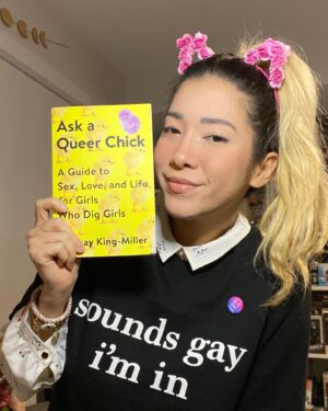 Michelle Grondine Instagram - a few september favorites:
- Ask A Queer Chick: A Guide to Sex, Love, and Life for Girls Who Dig Girls by Lindsay King-Miller @askaqueerchick,
- this ‘sounds gay i’m in’ shirt from @thtsoundsgay (use code travelingbooknerds to get 30% off your entire order). proceeds from @thtsoundsgay website sales are donated to youth GAS orgs and leaders across 🇺🇸 via @gsanetwork;
- freaking romance by @snailords on @webtoonofficial is a god-tier toon and zylith has given me the confidence to simply exist with cat ears at any time i desire (these are from @flowerchildrenonly). also every character is amazing and i ship both zylith   verose *and* zylith   the lavender scented ultra soft soft boy aka zelan;
- ‘bi-fi signal strong’ pin ‘cause puns 😆 (ps: happy bi  visibility month!);
- this collared crop top covered in kitten faces. (need i say more?);
- this eyeliner kitten wing that i somehow got evenly on the first try for both eyes that was some sort of magical manifestation come to life that i’m glad got documented for personal history purposes.
—————
q: what are some of your current obsessions?