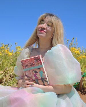 Michelle Grondine Instagram - aloha book nerds and pals 💞 your friend michelle here ✨ happy asian american pacific islander heritage month !!! ✨ this month, which is also my birth month & mental health awareness month, i will be doing my best to highlight & share some of my favorite books, films, and shows by my favorite asian & asian american creators! 

as you may or may not know, i was raised in tokyo, japan for most of my youth until i left home for college at 18. i studied japanese literature in HS, & grew up religiously reading manga. one of my goals i set for myself 2 yrs ago was to start reading japanese texts in both its original japanese as well as its translated english to get a feel for japanese stories & translations better, & see how a story exists in multiple languages. i hope to be able to continue on my journey this month, & through sharing my experiences, maybe inspire others to pick up some books by japanese authors, as well as other asian & asian american authors.

one of my favorite asian american authors is @sarahkuhnbooks. her novel I Love You So Mochi is such a heart-filling comfort read, & her Heroine Complex series is so fun & iconic—starring a biracial japanese personal assistant to a female superhero who is her childhood friend. Kuhn’s newest book, FROM LITTLE TOKYO, WITH LOVE, comes out May 11, 2021 from @penguinteen. i love that this book stars a “biracial girl with formidable judo skills & a fiery temper” who “knows she’s the least princess-like person in all of LA.” then, when a series of tantalizing clues start pointing to Rika’s mom being alive *&* a huge Hollywood movie star, it’s the start of a madcap quest—complete with the help of a dreamy sidekick in actor Hank Chen by her side. i’m quaking to find out what happens !!! i just know i’ll be experiencing the full range of emotions represented in the photo series above.

congratulations again to @sarahkuhnbooks & @penguinteen on this stunning release, i’m absolutely obsessed with the cover, & so excited by the existence of stories like this one. thank you for the dedication to the halfie club, & thank you for believing in our happily ever after.

Q: what’s an asian american book on your tbr this month?
