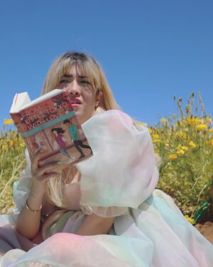 Michelle Grondine Instagram - aloha book nerds and pals 💞 your friend michelle here ✨ happy asian american pacific islander heritage month !!! ✨ this month, which is also my birth month & mental health awareness month, i will be doing my best to highlight & share some of my favorite books, films, and shows by my favorite asian & asian american creators! 

as you may or may not know, i was raised in tokyo, japan for most of my youth until i left home for college at 18. i studied japanese literature in HS, & grew up religiously reading manga. one of my goals i set for myself 2 yrs ago was to start reading japanese texts in both its original japanese as well as its translated english to get a feel for japanese stories & translations better, & see how a story exists in multiple languages. i hope to be able to continue on my journey this month, & through sharing my experiences, maybe inspire others to pick up some books by japanese authors, as well as other asian & asian american authors.

one of my favorite asian american authors is @sarahkuhnbooks. her novel I Love You So Mochi is such a heart-filling comfort read, & her Heroine Complex series is so fun & iconic—starring a biracial japanese personal assistant to a female superhero who is her childhood friend. Kuhn’s newest book, FROM LITTLE TOKYO, WITH LOVE, comes out May 11, 2021 from @penguinteen. i love that this book stars a “biracial girl with formidable judo skills & a fiery temper” who “knows she’s the least princess-like person in all of LA.” then, when a series of tantalizing clues start pointing to Rika’s mom being alive *&* a huge Hollywood movie star, it’s the start of a madcap quest—complete with the help of a dreamy sidekick in actor Hank Chen by her side. i’m quaking to find out what happens !!! i just know i’ll be experiencing the full range of emotions represented in the photo series above.

congratulations again to @sarahkuhnbooks & @penguinteen on this stunning release, i’m absolutely obsessed with the cover, & so excited by the existence of stories like this one. thank you for the dedication to the halfie club, & thank you for believing in our happily ever after.

Q: what’s an asian american book on your tbr this month?