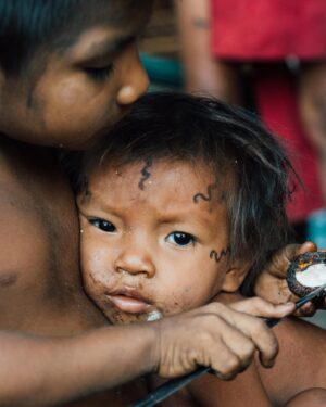 Mike Corey Instagram - LESSONS FROM 72H with the Yanomami Tribe of Venezuela.
One of the most isolated tribes in the Amazon Rainforest.

Hunting, fishing, and blowing Yopo. 

These are the moments I’m searching for. Authentic connection with people living lives so different than mine. The wisdom from just a few days lasts forever. Some big take always:

1. We must battle daily with our inner worlds. Most sicknesses are spiritual. The greatest wars are inside ourselves.

2. Barefoot allows a connection to earth. None of the Yanomami have ever worn shoes. Allow your body adapt and it will. We coddle our bodies too much, and we are weak because of it.

3. We become everything when we die. We melt into the earth, physically and spiritually. We are connected to everything. We came from it, and we will return to it. Every leaf has the soul of a person imbued inside. Treat it with respect.

4. Jaguars and Vipers are f*cking scary. There is no shame in fear, it must be embraced. Otherwise fear will kill your mind.

5. Loin-clothes are in. A bright red thong is the perfect wardrobe for the Amazon. I’m not wrong. You’re wrong. 

Photos by @rodrigoungaro 

Big love to @vidafuria If you want to visit Venezuela, message them on Instagram. This country is WILD. 🇻🇪
