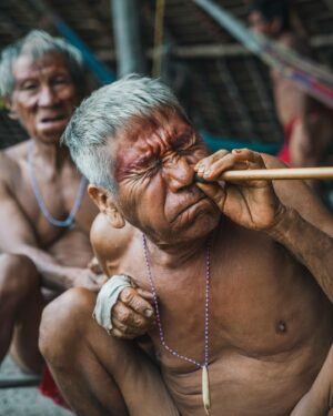 Mike Corey Instagram - FIGHTING SPIRITS WITH YANOMAMI SHAMANS
Every day at 3pm the Yanomami blow Yopo through bamboo into the noses of the shaman. This gray powder is composed of several seeds and leaves from the jungle which contain powerful hallucinogenic effects.

This allows the shaman to see spirits. 
This allows the shaman to fight spirits. 

The Yanomami believe that sickness is all in your mind, and you must battle daily against the bad spirits that try to infect your thoughts. 

I stepped in with the village elders and went to war with my own spirits. But I’ve got to ask my audience….

How much of our sickness is actually in our minds?
Drop your thoughts below.

If you want to visit Venezuela message @vidafuria 🇻🇪
Photos by @rodrigoungaro 📸

#venezuela #amazon #yanomami #tribe
