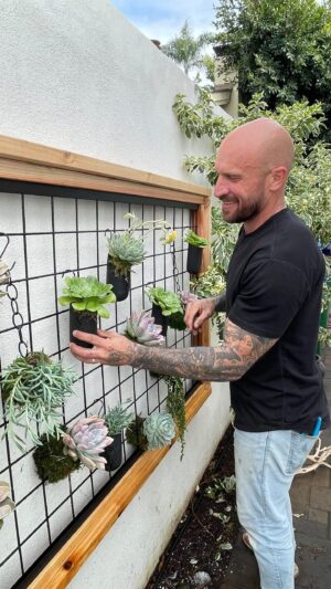 Mike Pyle Instagram - How to make a plant wall using a @wildhogproducts panel: 
🪵 Supplies Needed: 
Wild Hog Panel (I got mine at my local @ganahllumberco )
2 WHP tracks for the top and bottom of the panel
Wood to create a frame 
Wood screws 

💪🏻Make it: 
1. Measure wood to the size of the panel, leaving enough on the top and bottom pieces to cover the side pieces )this varies depending on what size wood you go for) 
2. Secure top and bottom pieces to your track system, centering the track
3. Place panel into track on top and bottom
4. Slide side wood pieces into place and secure to top and bottom with wood screws (drilling at an angle will ensure the side pieces don’t rotate) 
5. Hang on your surface using appropriate hardware
I opted to add a second layer of wood because I wanted a larger frame, but you do you! 

This panel can be used to hang pots (I got mine on @amazon ) tools, or create a self-contained living wall using the moss-hall technique I show here! (More on that in a future post) 

What do you think? 

#MPD #MikePyleDesign #Aesthetic #Design #OutdoorLiving #LandscapeDesign #Landscaping #WildHogProducts #Panels #LivingWall