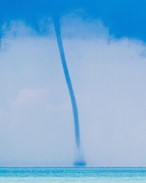 Mike Theiss Instagram - Florida Keys Waterspout ! This skinny waterspout danced on the ocean for over 20 minutes near the famous seven mile bridge in the #FloridaKeys. A waterspout is an intense columnar vortex that occurs over a body of water. They are connected to a towering cumulonimbus cloud. Waterspouts form in the tropics and subtropical areas. TAG someone you want to see a #waterspout with. Photo by Mike Theiss @ExtremeNature