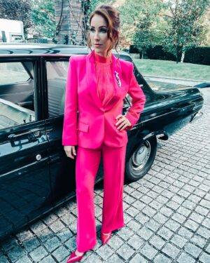 Miranda Frigon Instagram - Showin off my sweeeeet retro hot pink pantsuit (pretending the camera just happened to capture me that way) and posing with my talented, gorgeous tv daughter @brecbassinger  This is just one of my awesome wardrobe stylings by the fabulous @jddevine_ in the #vcandrews limited series “DAWN” currently airing on @lifetimetv  Stay tuned for the 3rd movie tmrw night - Saturday at 8/7c  All the movies are available for streaming on the #lifetime app after they air if you don’t have the channel. Hope you can tune in!!