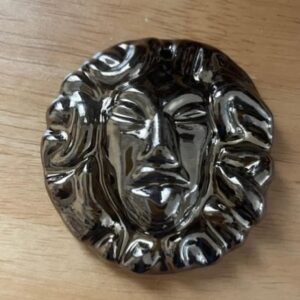 Natalie Haynes Instagram - Even though I was only in Amsterdam for about twenty minutes on Monday, @nonnanonnanonnanonna still found time to give me this glittering gorgoneion that she made for me. Nonna did her ceramics degree show on Greek myth - her work is amazing!