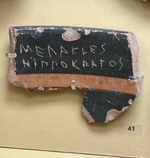 Natalie Haynes Instagram - Election day! At least, it is where I live.
And an opportunity to remember that people haven’t always voted FOR politicians; in 5th century BCE Athens, men (citizenship was restricted to adult male Athenians), could also vote AGAINST politicians or other noteworthy people. So if someone annoyed you, you could scratch his name onto a sherd of pottery (the Greek word for this is ostrakon - which is where our word ostracism comes from), and whoever got the most votes could be booted out of Athens for 10 years. There were some safeguards - a quorum of 6000 voters had to be present. 
But the system was set up to prevent demagoguery - as a general rule, anyone who has a high enough profile to affect democractic votes will also antagonise enough people to be at risk of ostracism. So unless your policies had a good impact quickly, you might be out on your ear. 
Here we can see lots of ostraka with names scratched on: Themistocles, Aristeides, Hippocrates and more.
I often find myself thinking that ostracism would be a good custom to revive, since it would really separate the popular politician from the ones who just shout culture war slogans. 
Happy voting!