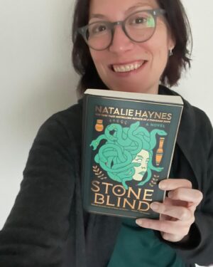 Natalie Haynes Instagram - You’ll be glad to know I am writing today, but I paused to be pleased to have my paws on a US paperback copy of Stone Blind for the first time!