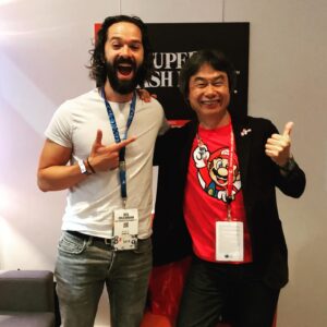 Neil Druckmann Instagram - Putting up some artwork... Meeting Miyamoto-san and then getting this signed by him was a childhood dream come true.