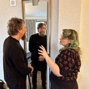 Neil Gaiman Instagram - Today I had the first fitting of the Dickens Beard. It looks incredibly real. Tomorrow it will be worn with hair and clothes and will be very Dickensian indeed. @loryn_pretorius made the beard and applied it and is seen here discussing making me into Mr D tomorrow.

Still a handful of tickets left for Monday and several big handfuls of tickets for Tuesday. NY town hall...