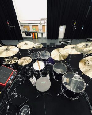 Nic Collins Instagram - ~ New tubs 🫠🟣 A massive thank you to @gretschdrums for making this beauty for me for the upcoming @officialmatm tour! We came up with a custom color way based on their deep black marine pearl finish. We Princed it up to make what I’ve originally named “Purple Marine Pearl” (took me ages to come up with that) 🙃 It sounds amazing and I can’t wait to take it out on the road in a couple of days. And of course, thank you to all my other endorsers; @sabiancymbals, @remopercussion, @promarksticks, @dwdrums, @rolandglobal, and @porter_and_davies. I’m incredibly lucky and honored to be able to play these companies.

Sizes:
- 6.5”x14” Snare
- 18”x22” Kick
- 7”x10” Rack Tom
- 9”x13” Rack Tom
- 16”x16” Floor Tom
- 16”x18” Floor Tom

~