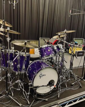Nic Collins Instagram - ~ New tubs 🫠🟣 A massive thank you to @gretschdrums for making this beauty for me for the upcoming @officialmatm tour! We came up with a custom color way based on their deep black marine pearl finish. We Princed it up to make what I’ve originally named “Purple Marine Pearl” (took me ages to come up with that) 🙃 It sounds amazing and I can’t wait to take it out on the road in a couple of days. And of course, thank you to all my other endorsers; @sabiancymbals, @remopercussion, @promarksticks, @dwdrums, @rolandglobal, and @porter_and_davies. I’m incredibly lucky and honored to be able to play these companies.

Sizes:
- 6.5”x14” Snare
- 18”x22” Kick
- 7”x10” Rack Tom
- 9”x13” Rack Tom
- 16”x16” Floor Tom
- 16”x18” Floor Tom

~