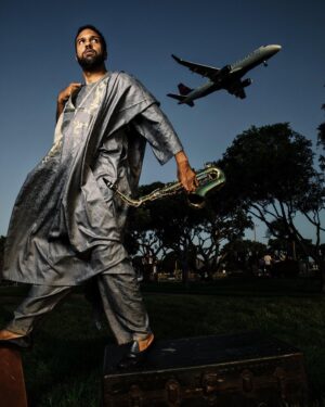O-T Fagbenle Instagram - This picture was taken by extraordinary photographer and my great personal friend @jmichaellorch - he tells stories through a single image. This is the text that accompanies this image.. THANK YOU JEFF! “My paternal ancestor, Lutiseku - which means great things to come - brought the Fagbenle clan across Nigeria to settle in Ibadjo. His son was similarly not one for settling, captaining some of Nigeria’s first railway trains cutting their way across Yoruba land. My maternal grandfather sailed across from the UK to Australia and piloted the first airplanes across the Antipodean skies during WWI.

My parents lived in many cities in my formative years, and, after receiving my first sax at 10 years old, I soon began touring Europe playing in “big bands” up until my early teens.

Samuel Beckett says there are two types of fools—the ones who stay put and the ones who keep moving. I am from lines of the latter.

In 2019 I took 52 flights — that’s one flight a week the entire year. I had also pushed myself over the past few years to accomplish more than I considered myself capable of doing to write, direct, produce and act for the TV show MAXXX. It was the hardest thing I had ever done. Then Covid paused it all.

I spent 5 months living in Tanzania with my mom in a small fishing and arts town on the edge of the Indian Ocean, Bagamoyo. I never thought I would enjoy a rural life, preferring the constant, moving energy of cities and travel--but I loved it. Homeschooling with my niece and nephews, drives through the beautiful country of Tanzania, a slower pace of life. Rest.

Things are gearing back up now, this summer I’ve seen airports in Dar Es Salaam, Amsterdam, London, Mexico, Los Angeles, Quebec and Toronto. Though for 2020 I’m trying to carry a piece of the rural with me, finding some still, while moving fast…”