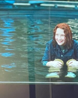 Olivea Morton Instagram - Here is the picture of myself and Uncle Rick that I mentioned in the interview with #EntertainmentRoadmap.  There is also a rehearsal for the fountain stunt where Cassandra is standing in for Walker.  It was my first wirework experience, and now I know how it feels I really want to do more stunts!

The entire crew made sure we were all safe and comfortable at all times.  I had a wetsuit on underneath my wardrobe, and was given all the hot tea, towels and blankets that I needed.  Even my trailer had a fireplace that kept everything nice and cozy!

I’m really happy that they decided to make Nancy and her friends pretty rather than how Percy describes us in the book, even though I was totally up for it!  But if you think about it, it’s written from a twelve year old boy’s perspective, and it makes sense.

Thank you to everyone who has watched the entire interview, I am a talker!  You have given me such wonderful compliments, and it means the world to me!  The entire time was a fantastical experience, one that I will cherish my entire life. 🔱🧡🩵

#rickriordan #nancybobofit #percyjacksonandtheolympians