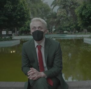 Oobah Butler Instagram - 2021! I caught Covid (twice). Filmed a new project in Mexico. Made my first TV show with a lot of amazing, talented people. Swapped a box of crap for a $20k Robert Frank print. Signed with @realthomascook @unitedtalent. Started work on a project with my dream collaborators Abso Lutely Productions. Played a lot of squash. Finished a new online short (screenshots attached). Started drinking triple shot coffees every morning. Wrote a piece on one of my favourite artists @christianjankowski_official. Gained 6lbs over Christmas leaving me looking swollen. Realised I look great in a dress. I’m immensely lucky, and am grateful for your support/attention. I wish you all the best of luck for 2022.
