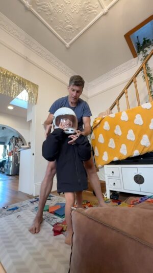 Osher Günsberg Instagram - Once you’ve built the biggest magnet tile tower of all time - how do you demolish it? Easy. Put on Dad’s motorbike gear (including jacket with body armour) and just send it. So committed. I adore this guy. I adore that the demo plan was his Mum’s idea. Love his thumbs up to show he’s all good.