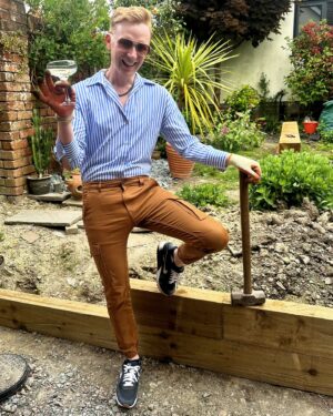 Owain Wyn Evans Instagram - Spirit level working overtime today 🔨 Been building a retaining wall for the garden using sleepers and now I am v thirsty! Quick outfit change for the final inspection 😂 Hope you’re having a productive Saturday dahlings, or if not… at least a gorgeoux one! xxx