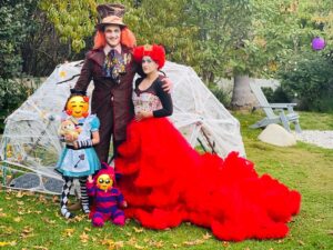Owain Yeoman Instagram - More adventures in Wonderland!  Halloween 2021! (Costume 2/3 😜) #halloweencostume #halloween #halloweenmakeup #halloween2021 #dressup #family #aliceinwonderland #wonderland #madhatter #queenofhearts #alice #chesirecat #everbelleyeoman #phoenixyeoman #wifey #hubby #party