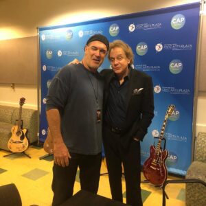 Patrick Warburton Instagram - I’m not sure about the lame face I’m making, but nice hang with the great Eddie Money. Thousand Oaks Benefit for first responders #firstresponders #thousandoaksstrong