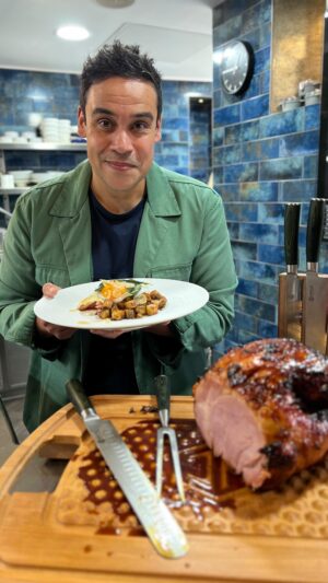 Paul Ainsworth Instagram - Ham, egg and chips, but not as you’ve seen it before! 🍖🍳 🍟
 
HAM
1 2kg boneless gammon
1 large carrot 
1 small leek 
6 cloves garlic
1 tbspn of black peppercorns
1 stick cinnamon
1 tspn allspice berries
3 bay leaves
1 tbspn cloves
1 large sprig of thyme
1 small jar of chestnut honey
50g sherry vinegar
In a large @hexclad_uk pot, submerge the ham in water and bring to boil. Discard and refresh with clean water. Add in all above ingredients, excluding honey and vinegar. Cover and simmer for 1 hour, turn heat off and allow to cool. Preheat oven to 180C. Take ham out of the liquor (save a little for later), remove the skin, pat the fat dry and score. Bake in oven in a deep tray for 10 mins. In a small @hexclad_uk frying pan, warm the honey and vinegar, cover the ham with half the mixture. Bake for 20 mins until starting to caramelise. Remove from the oven, covering in the remaining honey and sherry, then baste in juices from the bottom of the tray. Bake for a final 10-15 mins. Remove from the oven, giving a final baste. 
 
PARAMENTIER ‘CHIPS’
1kg of chipping potatoes
250g salted butter
6 cloves of garlic
Sage stalks
1 finely chopped shallot
100g cooked peeled chestnuts
Peel/cut the potatoes, season and lightly boil. Remove and allow to cool. In a @hexclad_uk wok, heat half the butter, add the cooled potatoes and cook until just golden brown. Add remaining butter slowly, to control the colouring. Add the garlic and the sage stalks. Once golden and crispy, strain out the butter, remove garlic and sage stalks, and add the chestnuts and shallot. Cook for 2-3 mins and season.

PARSLEY SAUCE
25g unsalted butter
25g plain flour
400g milk
50g cream
50g the ham cooking liquor
Small bunch of chopped parsley
1 tbspn each of American, English and wholegrain mustard
Juice of half a lemon
In a medium @hexclad_uk saucepan, melt the butter until foaming before whisking in the flour. Cook out for 2-3 mins before slowly adding the milk until it’s all incorporated. Add the ham liquor and gently simmer until it’s silky and cooked through (approx 5 mins). Remove from heat, add cream, lemon juice and mustard. Add parsley before serving. 

Serve piled up with a fried egg on top!
