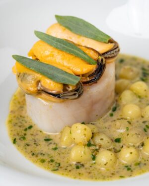 Paul Ainsworth Instagram - Cornish Cod ~ Steamed Mussels ~ Camel Valley Blanquette 

Caught in Cornish water, we take the loin of this outstanding fish and cure it using local kelp, before it’s gently poached in brown butter. 

This is then topped with stunning St Austell Bay mussels, which we’ve lightly steamed and dressed in a kombu vinaigrette. ⁠

To finish, we serve our blanquette made from our own exclusive Camel Valley sparkling Chardonnay, pink fir apple potatoes, finely chopped herbs and seaweed, as well as a generous spoonful of smoked pike roe right at the end for that subtle smoky note.