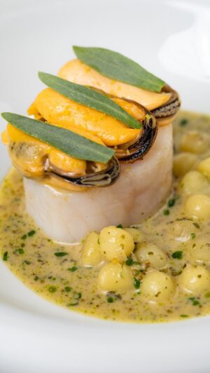 Paul Ainsworth Instagram - Cornish Cod ~ Grilled mussels ~ Camel Valley blanquette. A dish we created to celebrate some key Cornish produce. 

Immaculate Cornish cod loins - caught on day boats and sourced for us by @flyingfish525, we take the loin off the cod and cure it in kelp before lightly poaching it in brown butter.

The biggest and most delicious Cornish mussels - sourced from St Austell Bay, these beauties are farmed out in the deep water making them larger and more juicy. We steam them in kombu before warming them in a citrus seaweed butter.

We serve this with a blanquette sauce made from our exclusive @camelvalleyvineyard sparkling Chardonnay, shallots, ceps, hard herbs, Pink Fir apple potatoes, diced seaweed, chervil, lemon, crème fraiche and a little dollop of smoked pike’s roe for the texture and light smokey undertones.