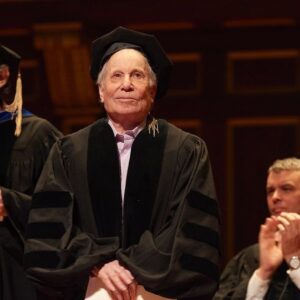 Paul Simon Instagram - Congratulations to the 2024 graduating class of @necmusic!

On Sunday, Paul was honored to address the students in a commencement speech, and to be presented with the honorary degree, Doctor of Music, quoting: 

“It’s a cliché but music really is the closest we come to a universal language. It crosses borders as effortlessly as a cloud. It nourishes culture like an underground spring. Music has the power to heal, to inspire, to make people weep or jump up and dance for joy. You have chosen a profession that can provide a lifetime’s journey into the ineffable.”