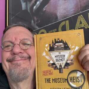 Penn Jillette Instagram - Look what I got!  A mystery puzzle adventure where I get to crack codes and clues to solve the crime by my “Magic Goes Wrong” @mischiefcomedy buddy, @henrywlewis. I can’t wait (to sit and watch while my wife figures it out!). 

Mystery Agency: The Museum Heist
A mystery puzzle adventure where readers must crack codes and find clues to solve the crime.

The book comes out in the USA on 20th Feb, but you can pre-order it now on Amazon.

And if you’re in New York in the next few weeks, go see Henry in @mindmanglernyc !

@mysteryagencygame 
@littlebrown
@henrylewis