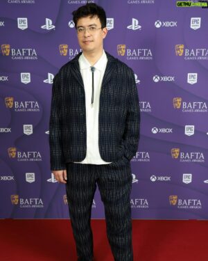 Phil Wang Instagram - Thank you @bafta for letting me present the 2024 BAFTA Games Awards. What a thrill and privilege for someone who always told his parents games were art actually. Got to meet the original Lara Croft (Shelley Blond), Max Payne’s face (@samlakewrites), and even got to do the Spidermen meme with two actual Spidermen (@yurilowenthal @officialnadjijeter).

Congratulations to all the winners and nominees. What a dream of a night!

📸: @alexingramphoto @bafta