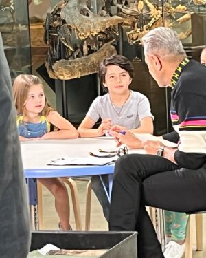 Pyper Braun Instagram - I am so behind on posting! We were super pumped to work with and meet this icon! Unfortunately the episode did not air, which is just a part of this industry. Pyper had so much fun chatting with @jeffgoldblum , and he even took a moment to snap a photo.
We got to film at the @nhmla , meet a paleontologist , and see real fossils!
We will definitely be back to the museum!
She was also very excited to see her buddy @carter.chee  and work with him again!
•
#seeyalaterostrich #blessed #grateful #setlife #workingkid #dinosours #jurrassicpark #jurrassicworld