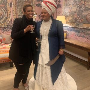 Radha Blank Instagram - I just needed to use this space to celebrate the QUEENS behind this dynamic dress design.

I knew what I wanted but cannot draw to save my life. Denise Trotman, my best friend of over 30 years, lent her amazing talent in sketching our design but added details I could have never imagined. Denise there is no way I could have done this without you. That day we went to pick out the fabrics is proof! We found just what we needed because you are my good luck charm! God blessed me with your friendship but he blessed us all with your gift as an artist! 

And then Jenny. Lord. Where do I begin? Not sure you remember but when you first came to my house to take my measurements I freaked out when I saw your hands. They looked like my mothers hands! She also wore turquoise nail color! I took a picture knowing this meant my mom was in the room and this was meant to be! This powerhouse Jenny has been making clothes, reconstructing and remixing garments for decades and how blessed am I that she was able to complete this look IN JUST THREE WEEKS!!! When I showed up to look at muslin she damn near had a whole dress completed! Grateful @brandicedaniel put me in touch with you and your mastery Jenny. 

The design was evolving…long coat to short coat…layered denim to bustle effect but what never wavered was each of your beautiful Black women’s determination to get the final garment for the Obeah Woman DOWN!  Denise my Trini queen and Jenny my Jamaican queen. Thank you ladies!!
🇹🇹❤️🇯🇲

#blackwomen #madebyblackwomen #obeahwomancomeintotheroom #wegoodthx! #metgala #metinamerica #metcostumeinstitute 

Special out to @kellyaugustine for her keen eye and input and pulling the other elements in! Next post is yours ma!