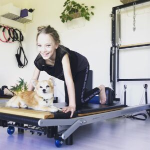 Raffiella Chapman Instagram - Everyone needs a workout buddy! Tango is my personal trainer at Pilates Reformer! @theviewpilates #dogsofinstagram #pilatesreformer #pilates