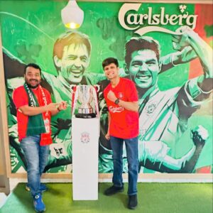 Rahul Subramanian Instagram - The two of us have been fans of Liverpool FC for more than 2 decades, in fact , we became friends because we both loved Liverpool FC . It was our dream for many years to once come to Liverpool , and watch them play at Anfield . Over the last few years- it had become a shared dream - “ Saath mein ek din Anfield jaake match dekhenge yaar “ - is a sentence we’ve said to each other every week for the last 10 years of our friendship . And then this season , we got to know that Jurgen Klopp is leaving . Klopp has been a figure we’ve both idolised for the last >8 years . We said to each other “We have to go to Anfield before Klopp  leaves “ . In came the good folks at @carlsbergindia who helped us realise this dream . They helped us live a day we had never imagined we will live . To be inside Anfield , sing YNWA with 60 thousand  fans , to watch Salah score a goal , to watch LFC win . To meet the man of the match and a World Cup winner - Alexis Mac Allister AND TO MEET THE MAN HIMSELF - Jürgen Klopp. To be hugged by the man himself !!! Probably the best day of our lives. Thank you Carlsberg - you’ll never walk alone .