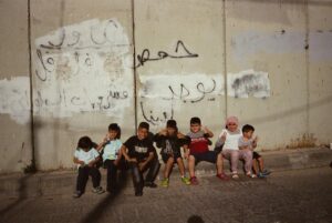 Ramy Youssef Instagram - these are some of the most beautiful artists i know. i’m scared for them, and i always have been. we were in palestine together when Shireen Abu Akleh was murdered— an american journalist in a press vest, killed by a soldier. some of our crew had worked with her. i remember the panic in their faces. i remember how there was never any legal recourse for her murder. there never is. they have witnessed decades of human-rights violations and children killed. i am horrified at what has happened to palestinian lives. i am horrified at what has happened to israeli lives. i have spent so much of my adult life praying for everyone in the region. praying for my PTSD-filled muslim and jewish sisters and brothers around the world— as well as christians there and beyond. 

this past week has broken the heart of all in my life - muslim, jewish, christian, atheist. we fully condemn the death of civilians. we always have. and now we are witnessing the latest inhumane chapter of a story that desperately needs to end. it serves no one. 

here we are helplessly trying to figure out foreign policy on instagram— because leaders have failed us. it is to the benefit of totalitarianism and capitalism above humanity, when we turn to hate speech and in-fighting. i refuse to be distracted. there are hostages and dead bodies and gaza is on the brink of being destroyed. entire generations of families. these are civilians with no recourse and nowhere to go. a million people are being asked to evacuate to nowhere. the people of gaza do not deserve to pay the price for our failings. if gaza is erased, history will see we stood by. that we failed to find our humanity. 

this is an incomplete post that will never encapsulate all that I hold in my heart or give anyone all they need. still i am posting these photos because I want you to see these faces. i thought what if your only images are of devastation? i share these photos because these artists have so much to share about the human condition. i want them to have a livelihood, to feel safe, to flourish, to have freedom. and i want the world to see their art.