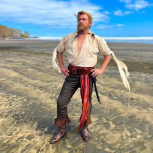 Rhys Darby Instagram - Dreamboat Stede. @sambaschutte took this one of me on the sands of Te Henga, Bethells beach Aotearoa New Zealand. @ourflagonmax #ourflagmeansdeath #ofmd